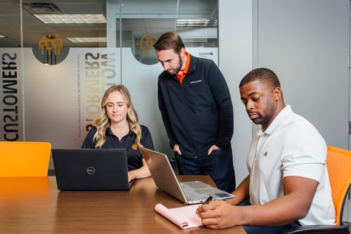 SkillStorm employees working at their laptops SkillStorm employees working at their laptops